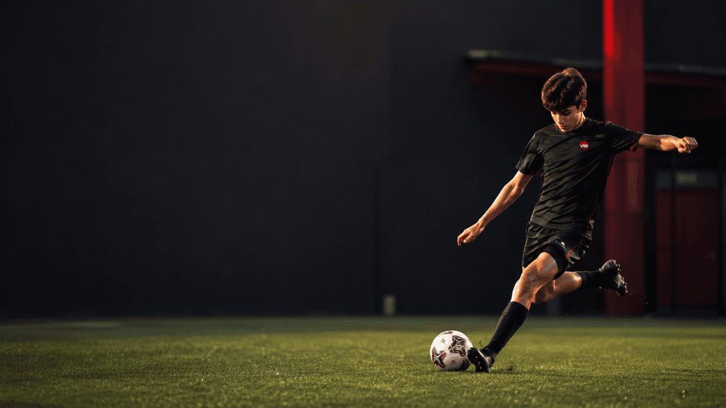Vanguard Sports Academy Official Player Kicking Ball